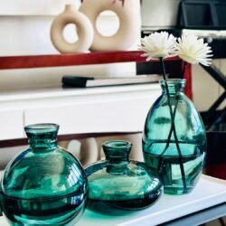 Green vases_upclose_on white tray_cream vase view