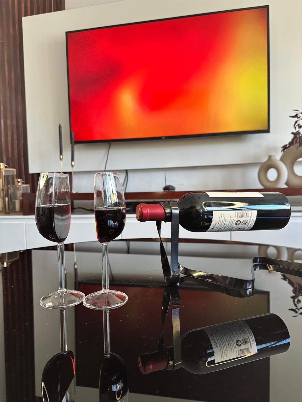 Half wine glasses_filled_black wine string_TV view