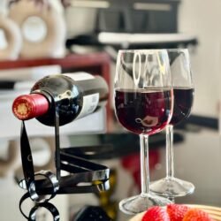 Half wine glasses_filled_black wine string_coffee table