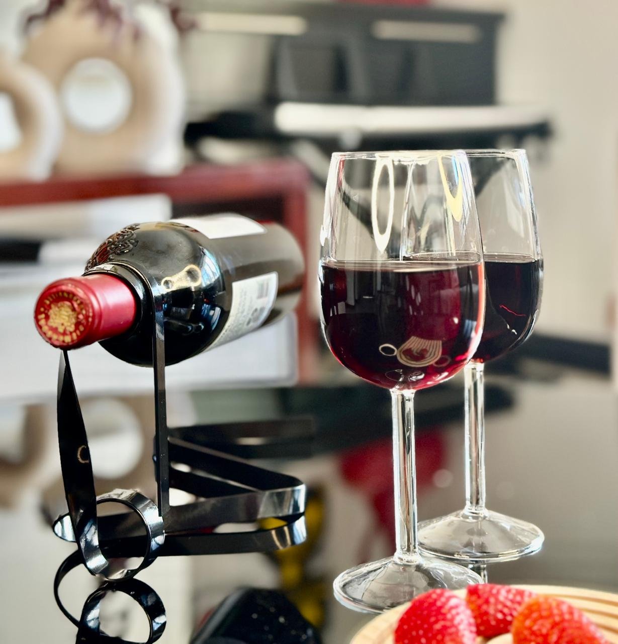 Half wine glasses_filled_black wine string_coffee table