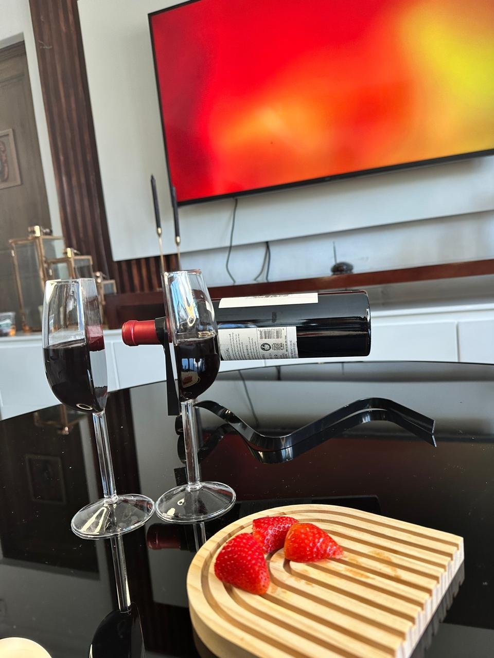 Half wine glasses_filled_coffee table_oval tray_TV view