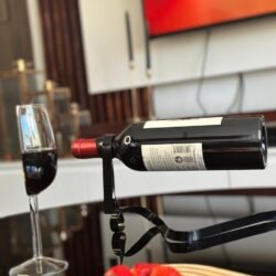 Hanging bottle holder_Black_with half wine glass_coffee table